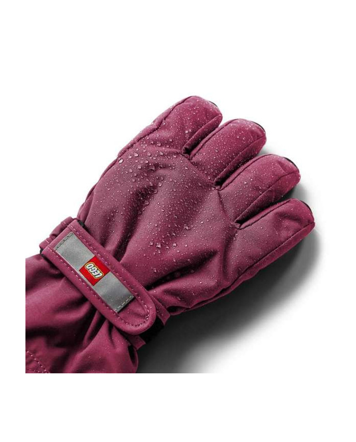 Bernumode | LEGO® Wear: Waterprooof gloves with membrane LWATLIN 700 €29.71 LEGO® Wear PLAY gloves for children
A pair of smart and functional ski gloves makes playing outside a lot more fun on cold and wet days. The many functional features make sure that your child’s fingers are kept dry and warm regardless of the weather.
The LEGO® Wear PLAY glove has an ergonomic fit and an elasticated wrist with a reflector and Velcro closure for an optimum fit. The glove entry is also elasticated to keep snow out. With a PU anti-slip material on the palms and fingertips for a better grip.
THIS IS WHY YOU WILL LOVE THE GLOVES

They are 100% windproof, windproof, and breathable
There is a buckle on the gloves for clicking them onto LEGO Wear jackets and snowsuit
The gloves have a soft isolating Thinsulate insulation¨
The gloves come in so many great colours

The gloves are made in a 100% windproof and breathable material. They have a waterproof and breathable Fan-Tex membrane between the inner and outer layer which makes the gloves 100% waterproof. The inner layer is a comfortable and insulating Thinsulate material.
The gloves can be hooked together at the wrist to keep the pair together when they are not in use. Safety break-away buckle for attaching the gloves to a snowsuit or jacket sleeve. The buckle releases when pulling the gloves, so that your child does not get stuck on anything.


Specifications

Adjustable strap at wrist with Velcro closure.
Elastic at wrist keeps the glove in place.
Soft elastic at opening.
Thinsulate insulation.
Soft microfleece lining inside gloves.
100% waterproof and breathable Fan-Tex membrane inside gloves.
Ergonomic fit.
PU anti-slip material on palm for better grip.
3M Scotchlite reflector.
Breakaway buckle only in size: 104 - 140.
Bionic Finish ECO water repellent finish on the surface.
Windproof.


