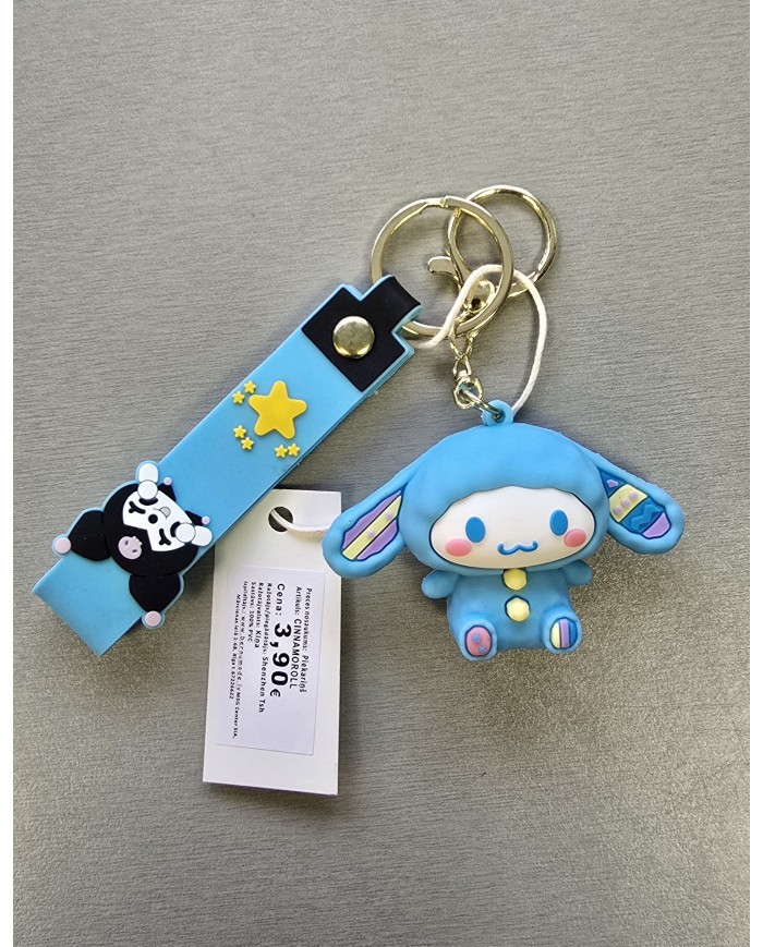 Bernumode | 3D Keychain -Sanrio, Cinnamoroll €3.22 
Cinnamoroll is a character created by the Japanese company Sanrio in 2001. He is a white puppy with long ears that allow him to fly, blue eyes, pink cheeks, and a curled tail resembling a cinnamon roll. His height is about 17 centimeters, and his birthday is celebrated on March 6th.
Backstory: One day, the owner of a small café called "Café Cinnamon" saw a white puppy descend from the sky like a fluffy cloud. Since he landed near her café and smelled like cinnamon, she named him Cinnamoroll. He quickly became a favorite among the café's visitors and the official mascot of the café.
Cinnamoroll's Friends:

Mocha: A stylish dog with chocolate-colored fur and pink ribbons.
Espresso: An intellectual puppy known for his excellence in music and drawing.
Cappuccino: A food-loving and sleepy puppy known for his big appetite.
Chiffon: An energetic girl dog who loves tennis and dreams of winning an Olympic gold medal.
Milk: The youngest of Cinnamoroll's friends, known for his attachment to a pacifier and desire to be like Cinnamoroll.

Media Appearances: Cinnamoroll became the protagonist of the manga "Fluffy, Fluffy Cinnamoroll," published in the Pucchigumi magazine from 2005 to 2008. He also starred in an animated film released in 2007. In 2005, a group called "Cinnamoangels" was formed, consisting of Mocha, Chiffon, and Azuki, with the goal of becoming idols.
Cinnamoroll continues to be a beloved character in Sanrio's lineup, appearing in various merchandise, animated series, and more.

