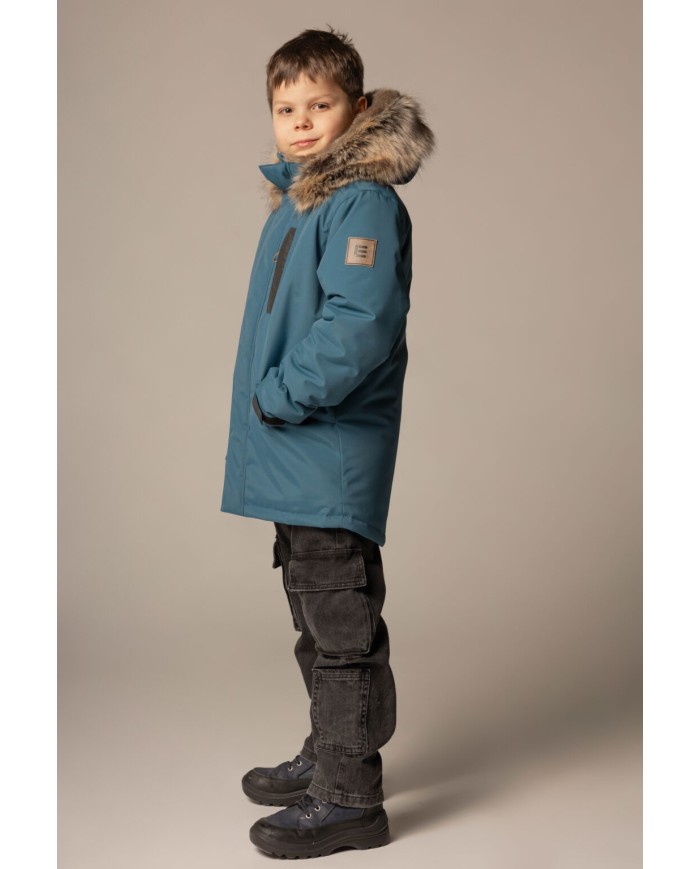 Bernumode | Lenne: Jacket/Parka HANNO 250 g €105.06 Water column: 10 000 mm
Breathable: 10 000 g/m²/24h
Water and soil reprellency: DWR coating (Durable Water Repellent)
BEST SELLER! Boys’ winter parka with luxurious fur
Boys’ parka with a zippered furry hood
This solid-colour Le-Company winter parka is a definite favourite among schoolboys. The fluffy parka features a cool zippered hood, which can be opened to reveal even more fur that covers shoulders. The parka is longer in the back and made of highly waterproof and breathable ActivePlus fabric, which ensures maximum comfort at all times. The waterproof surface of the fabric protects from wind, rain and snow, does not become deformed and handles regular washing, maintaining its initial qualities. Adjustable sleeves. The front of the parka features two zippered sidepockets and a zippered chest pocket. The hood is fully detachable with snap fasteners.
Our high-tech Active+ fabric has a waterproof membrane which prevents water from coming through the product. At the same time it has the ability to evaporate sweat. ◆Water resistance: water column 10 000 mm ◆Breathability: water vapour transmission rate 10 000 g/m²/24h ◆Wind resistance: air permeability 0 l/m²s ◆Water and soil reprellency: DWR coating (Durable Water Repellent)
EXTRA WARM ⁑⁑ insulation is the best choice for frosty weather. Breathable fabric keeps your child from sweating. Heat retaining capacity is much higher than in usual wadding. Offers wearers comfort and freedom of movement in -1..-30°C.
Loop for attaching the reflector.
 Bernumode | Lenne: Jacket/Parka HANNO 250 g €105.06 Water column: 10 000 mm
Breathable: 10 000 g/m²/24h
Water and soil reprellency: DWR coating (Durable Water Repellent)
BEST SELLER! Boys’ winter parka with luxurious fur
Boys’ parka with a zippered furry hood
This solid-colour Le-Company winter parka is a definite favourite among schoolboys. The fluffy parka features a cool zippered hood, which can be opened to reveal even more fur that covers shoulders. The parka is longer in the back and made of highly waterproof and breathable ActivePlus fabric, which ensures maximum comfort at all times. The waterproof surface of the fabric protects from wind, rain and snow, does not become deformed and handles regular washing, maintaining its initial qualities. Adjustable sleeves. The front of the parka features two zippered sidepockets and a zippered chest pocket. The hood is fully detachable with snap fasteners.
Our high-tech Active+ fabric has a waterproof membrane which prevents water from coming through the product. At the same time it has the ability to evaporate sweat. ◆Water resistance: water column 10 000 mm ◆Breathability: water vapour transmission rate 10 000 g/m²/24h ◆Wind resistance: air permeability 0 l/m²s ◆Water and soil reprellency: DWR coating (Durable Water Repellent)
EXTRA WARM ⁑⁑ insulation is the best choice for frosty weather. Breathable fabric keeps your child from sweating. Heat retaining capacity is much higher than in usual wadding. Offers wearers comfort and freedom of movement in -1..-30°C.
Loop for attaching the reflector.