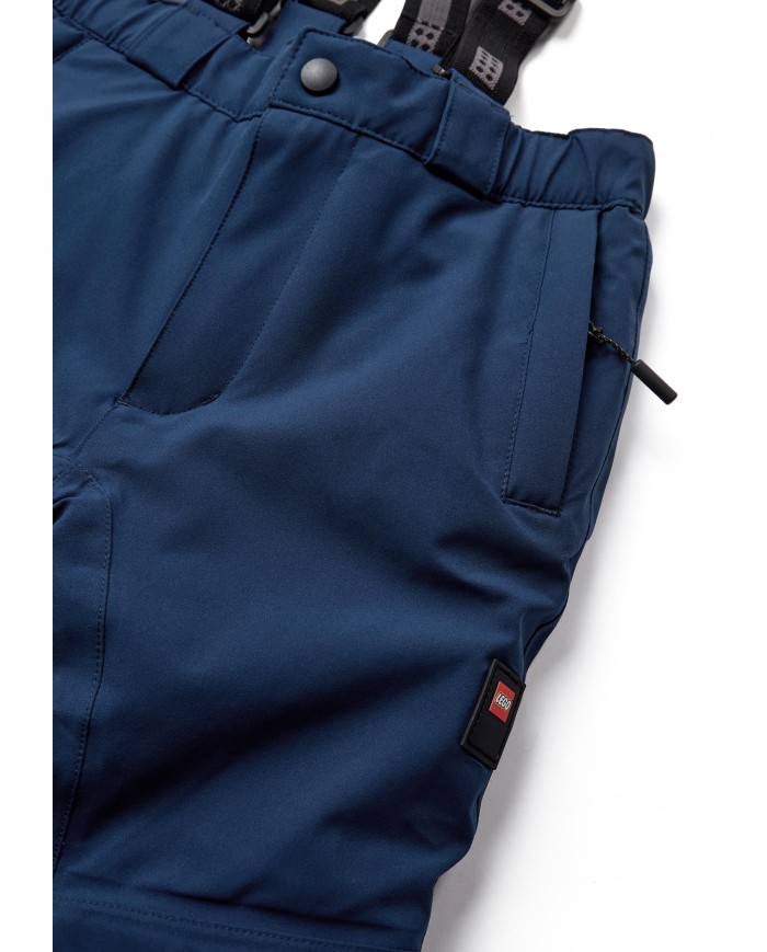 Bernumode | Lego: Kids' waterproof ski pants, LWPOWAI 708  (120 g) €66.90 Durable LEGO® ski pants for kids
These LEGO® ski pants are designed to keep boys and girls comfortable and protected during winter adventures. With a focus on functionality and style, these pants are perfect for skiing and other snowy activities.They have a 10.000 mm water column and are manufactured with fully taped seams to ensure that they keep your son or daughter dry on the playground as well as on the slopes. The durable, breathable, windproof, and even completely waterproof ski pants are reinforced at the leg opening with Cordura reinforcement and have a snow skirt with gripper elastic inside to keep snow out.

Water column of 10,000 mm provides protection from the rain
BIONIC-FINISH ECO® water-repellent finish on the surface
Windproof design to keep the cold at bay
Durability: withstand 60,000 rubs
Cordura reinforcement at the leg opening and inseam for durability
Fully taped seams to ensure that the snowpants are waterproof
Length extension feature inside legs for growing kids
3M reflective piping at the bottom part of the ski pants
Detachable and adjustable suspenders for a perfect fit
The integrated elastics at the waist provide added comfort
Snow skirt with gripper elastic inside bottom legs to keep snow out
Quality YKK main zipper and snap button closure
Zipper pockets on the front

The pants feature a breathable design with a breathability rating of 4,000 g/m2/24hours, ensuring comfort during active play. The reflective thread in the zipper puller at the front pockets adds a touch of safety, while the snap button at the front opening ensures easy wear. Inside the ski pants, there is a smart feature: The length of the trousers can be adjusted by one size, so they can be worn for a longer period of time. All in all, these high-quality ski pants will make your kid's winter adventures even more fun!
Specifications• -15 degrees Celsius / 5 Fahrenheit.• 3M reflective piping.• BIONIC-FINISH ECO® water-repellent finish on the surface.• Breathability: 4.000 g/m2/24hours.• Cordura reinforcement.• Detachable and adjustable suspenders.• Durability: 60.000 rubs.• Elastic at waist sides.• Fully taped seams.• Length extension feature inside legs.• Reflective thread in zipper puller at front pockets.• Snap button at front opening.• Snow skirt with gripper elastic inside bottom legs.• Water column: 10.000 mm.• Windproof.• YKK main zipper.• Zipper pocket(s) on front.
