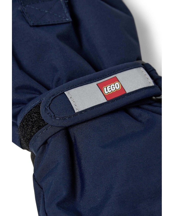 Bernumode | LEGO® Wear: Waterprooof gloves with membrane LWATLIN 700 €26.00 LEGO® Wear PLAY gloves for children
A pair of smart and functional ski gloves makes playing outside a lot more fun on cold and wet days. The many functional features make sure that your child’s fingers are kept dry and warm regardless of the weather.
The LEGO® Wear PLAY glove has an ergonomic fit and an elasticated wrist with a reflector and Velcro closure for an optimum fit. The glove entry is also elasticated to keep snow out. With a PU anti-slip material on the palms and fingertips for a better grip.
THIS IS WHY YOU WILL LOVE THE GLOVES
They are 100% windproof, windproof, and breathable
There is a buckle on the gloves for clicking them onto LEGO Wear jackets and snowsuit
The gloves have a soft isolating Thinsulate insulation¨
The gloves come in so many great colours
The gloves are made in a 100% windproof and breathable material. They have a waterproof and breathable Fan-Tex membrane between the inner and outer layer which makes the gloves 100% waterproof. The inner layer is a comfortable and insulating Thinsulate material.
The gloves can be hooked together at the wrist to keep the pair together when they are not in use. Safety break-away buckle for attaching the gloves to a snowsuit or jacket sleeve. The buckle releases when pulling the gloves, so that your child does not get stuck on anything.
Specifications
Adjustable strap at wrist with Velcro closure.
Elastic at wrist keeps the glove in place.
Soft elastic at opening.
Thinsulate insulation.
Soft microfleece lining inside gloves.
100% waterproof and breathable Fan-Tex membrane inside gloves.
Ergonomic fit.
PU anti-slip material on palm for better grip.
3M Scotchlite reflector.
Breakaway buckle only in size: 104 - 140.
Bionic Finish ECO water repellent finish on the surface.
Windproof.
 Bernumode | LEGO® Wear: Waterprooof gloves with membrane LWATLIN 700 €26.00 LEGO® Wear PLAY gloves for children
A pair of smart and functional ski gloves makes playing outside a lot more fun on cold and wet days. The many functional features make sure that your child’s fingers are kept dry and warm regardless of the weather.
The LEGO® Wear PLAY glove has an ergonomic fit and an elasticated wrist with a reflector and Velcro closure for an optimum fit. The glove entry is also elasticated to keep snow out. With a PU anti-slip material on the palms and fingertips for a better grip.
THIS IS WHY YOU WILL LOVE THE GLOVES
They are 100% windproof, windproof, and breathable
There is a buckle on the gloves for clicking them onto LEGO Wear jackets and snowsuit
The gloves have a soft isolating Thinsulate insulation¨
The gloves come in so many great colours
The gloves are made in a 100% windproof and breathable material. They have a waterproof and breathable Fan-Tex membrane between the inner and outer layer which makes the gloves 100% waterproof. The inner layer is a comfortable and insulating Thinsulate material.
The gloves can be hooked together at the wrist to keep the pair together when they are not in use. Safety break-away buckle for attaching the gloves to a snowsuit or jacket sleeve. The buckle releases when pulling the gloves, so that your child does not get stuck on anything.
Specifications
Adjustable strap at wrist with Velcro closure.
Elastic at wrist keeps the glove in place.
Soft elastic at opening.
Thinsulate insulation.
Soft microfleece lining inside gloves.
100% waterproof and breathable Fan-Tex membrane inside gloves.
Ergonomic fit.
PU anti-slip material on palm for better grip.
3M Scotchlite reflector.
Breakaway buckle only in size: 104 - 140.
Bionic Finish ECO water repellent finish on the surface.
Windproof.
