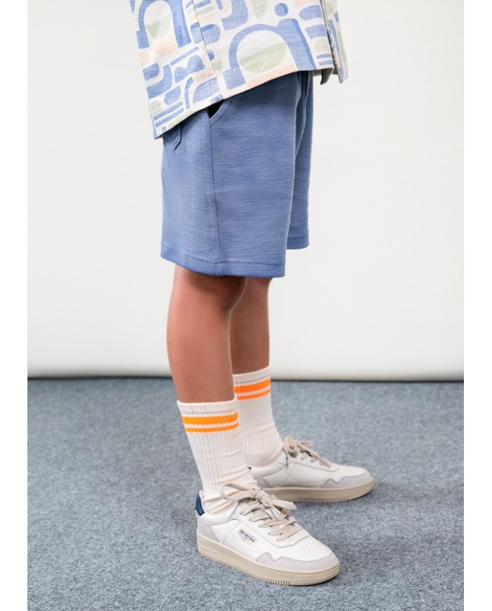 Bernumode | Mayoral: Boy’s Knit Shorts — BOSTON Collection €18.10 

The Boston Kids is the children's version of Boston, created for a new generation of bold, free-spirited kids. True originals who want to express themselves in their own way. Stylish, personality-packed clothing designed to keep up with their everyday adventures, effortlessly.
Our first kids’ collection, for ages 4 to 14, captures the essence of the original brand. Spontaneous, versatile, and full of color, it blends design and functionality to make everyday moments feel special. Oversized, relaxed fits, soft tones, and bold, figurative prints with fluorescent accents are key features of this capsule made for kids who never get bored.


