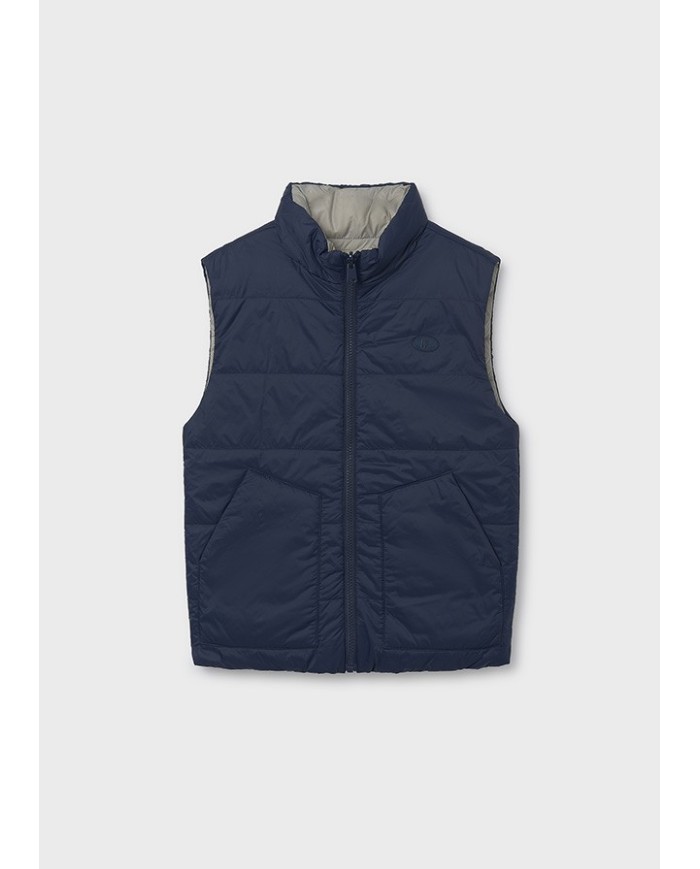Bernumode | Mayoral: Boys’ Reversible Vest €34.30 Made with recycled polyester. Boys' vest. Hooded collar. Central front zipper closure. Soft polyester inner lining. Functional front pockets. This model features a reversible design.